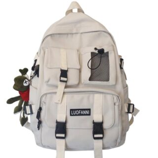 Trendy white travel backpack with hanging plush and white background