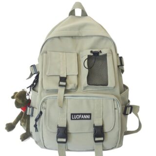 Trendy white travel backpack with plush on the side with a white background