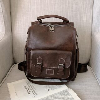 Vintage brown leatherette backpack with book
