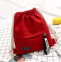 Women's red canvas backpack with black closure