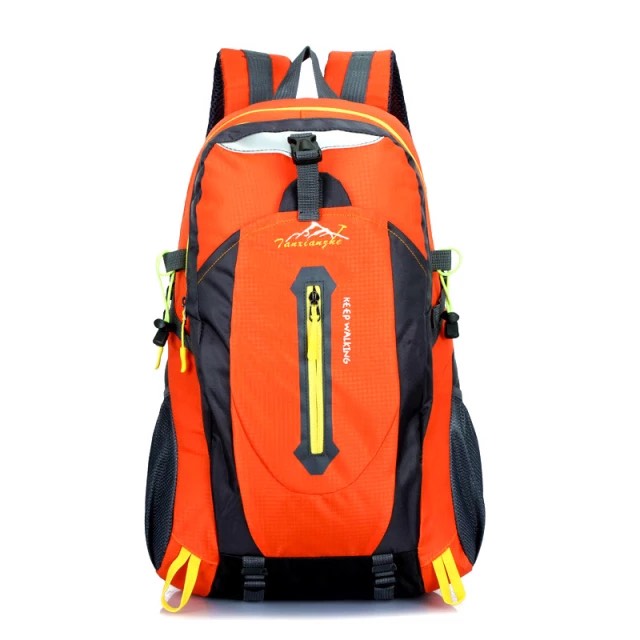 Large orange ski backpack with white background