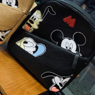 Mickey Mouse mini backpack for children in black with a wooden chair on the bottom