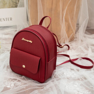 Mini backpack made of polyester leather in a fashionable garnet colour