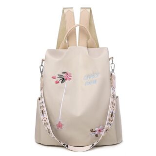 Women's beige flower embroidered backpack with white background