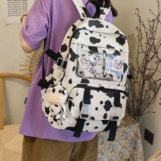 Cow print backpack with cute design on a girl's back