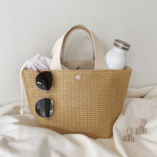 Bohemian women's beach basket in beige with a white background