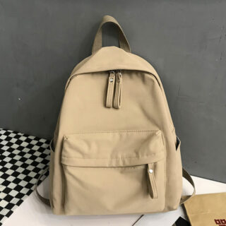 Sac à dos en toile à la mode pour femme marron avec un fond gris