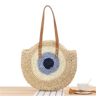 Round woven straw beach bag for women with a wooden table bottom