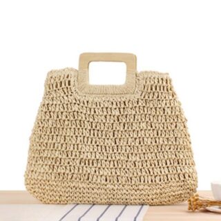 Women's straw beach bag beige with white background