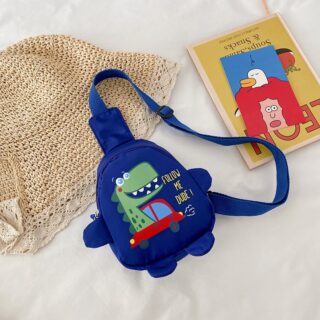 Kindergarten bag small dinosaur for child with straw hat behind and a book